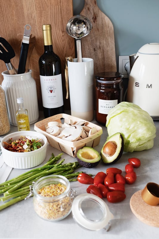 Fresh vegetables and meal-preparation ingredients in a warm kitchen
